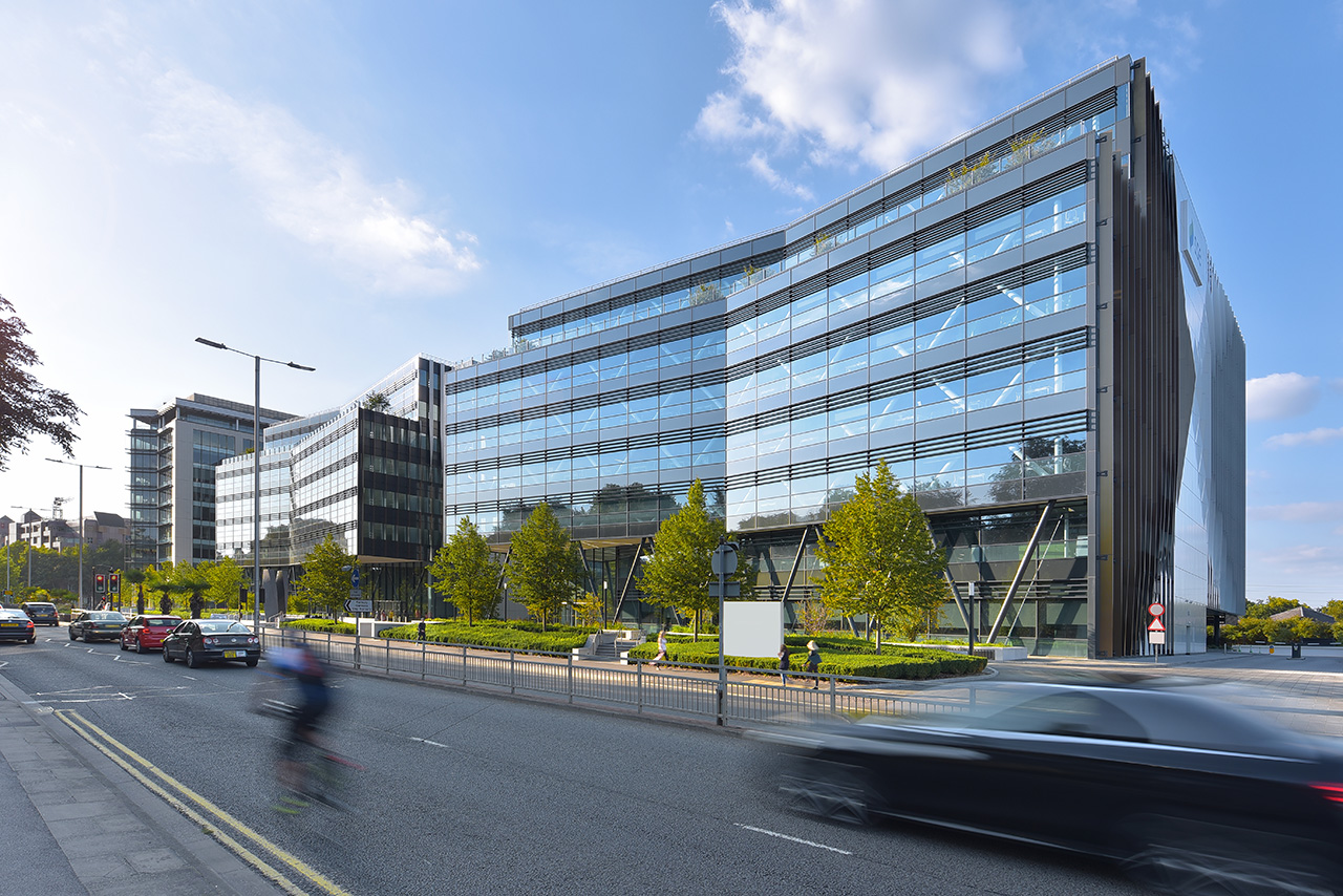 Office building photograph with car and bike passing by in Reading berkshire