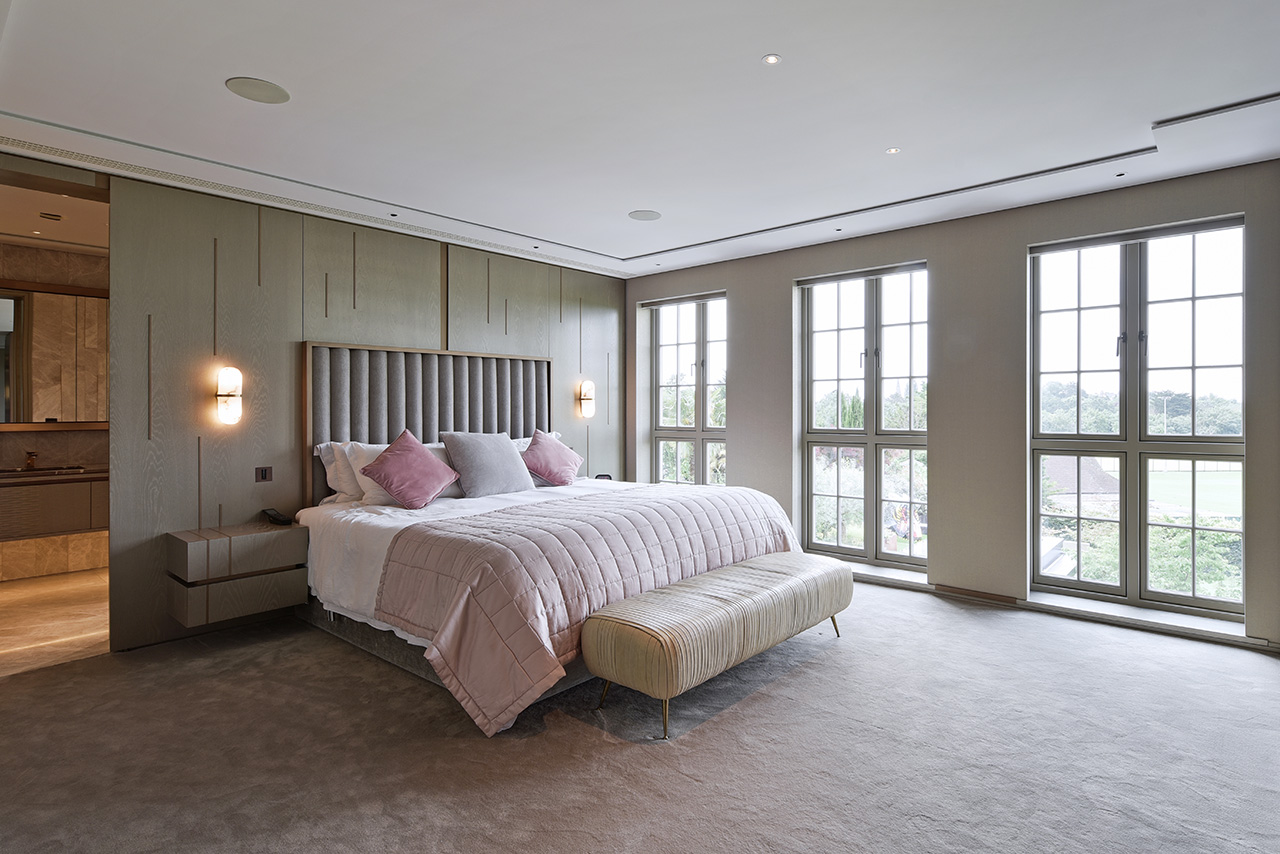 interior photo of luxury bedroom with large windows