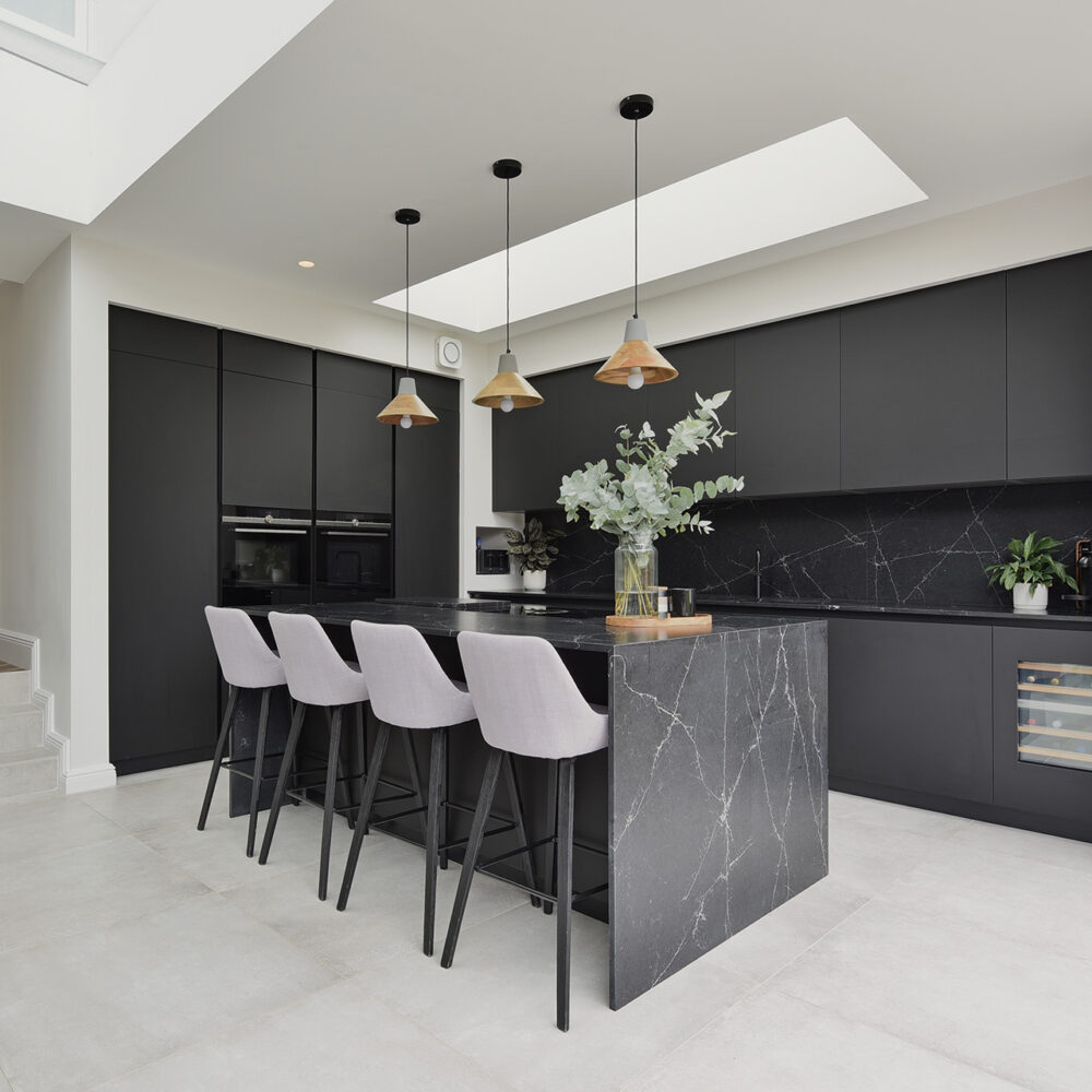 square photo of black and white kitchen
