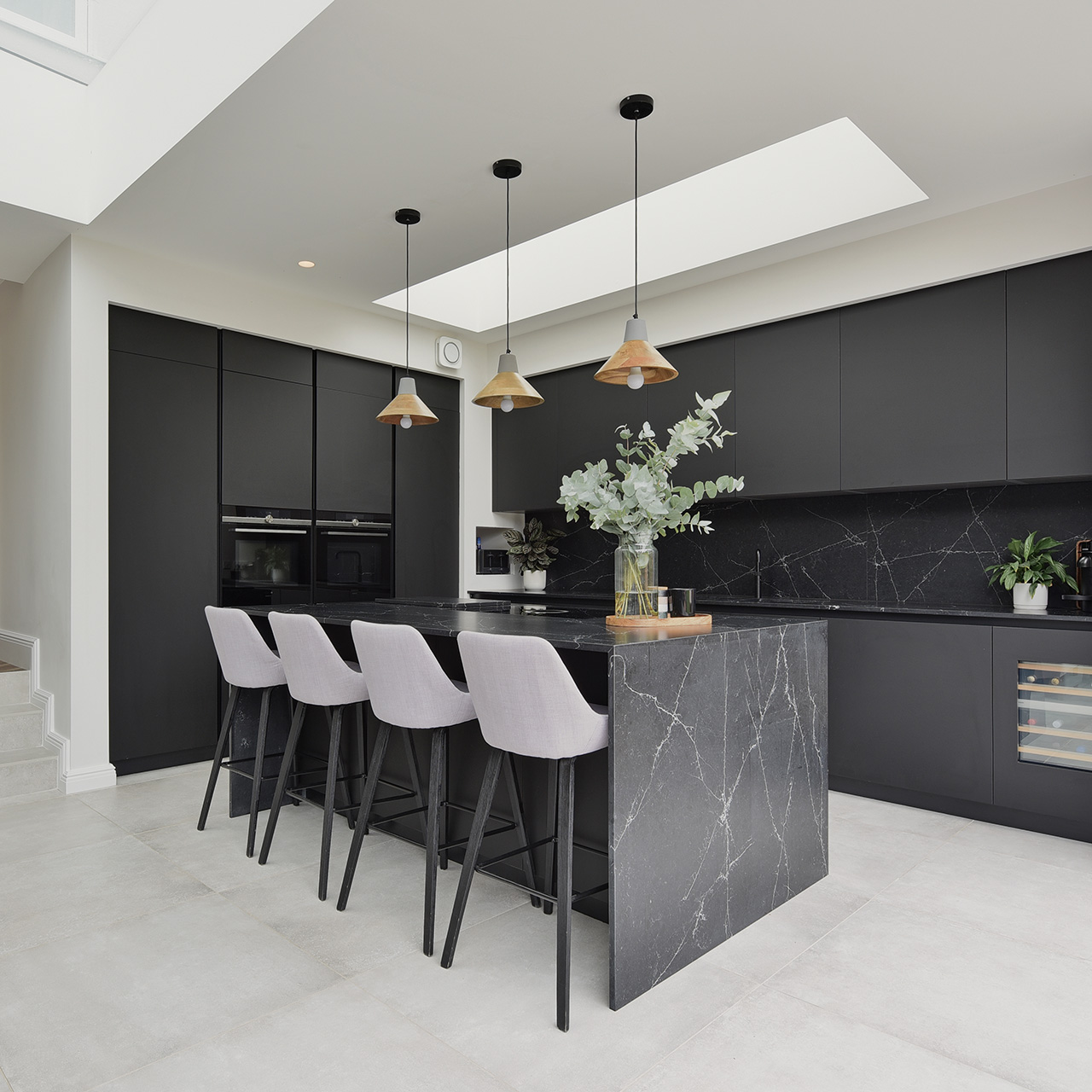 square photo of black and white kitchen