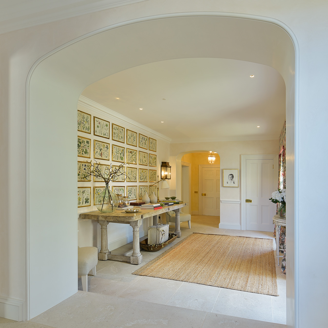 square photo of hallway with artworks