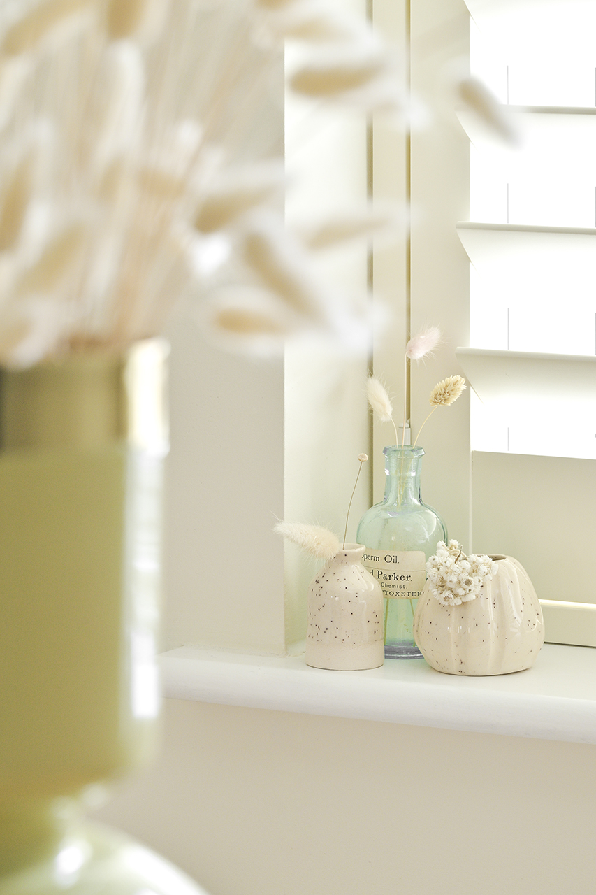 interior design photo of pots and jars on window ledge
